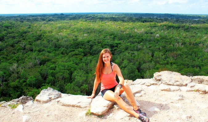 Solo girl traveler hikes to the top of a mountain in Mexico