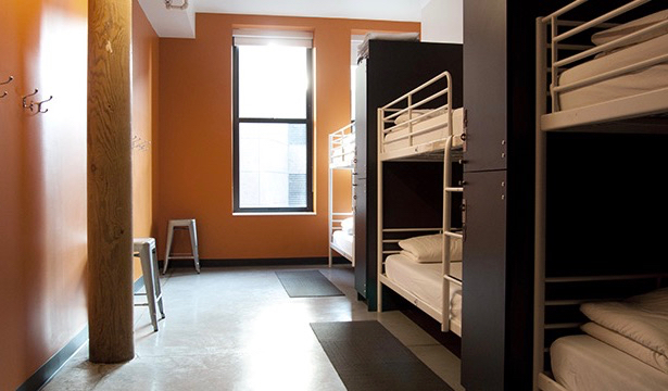 A clean and comfortable dorm room in the HI Boston hostel