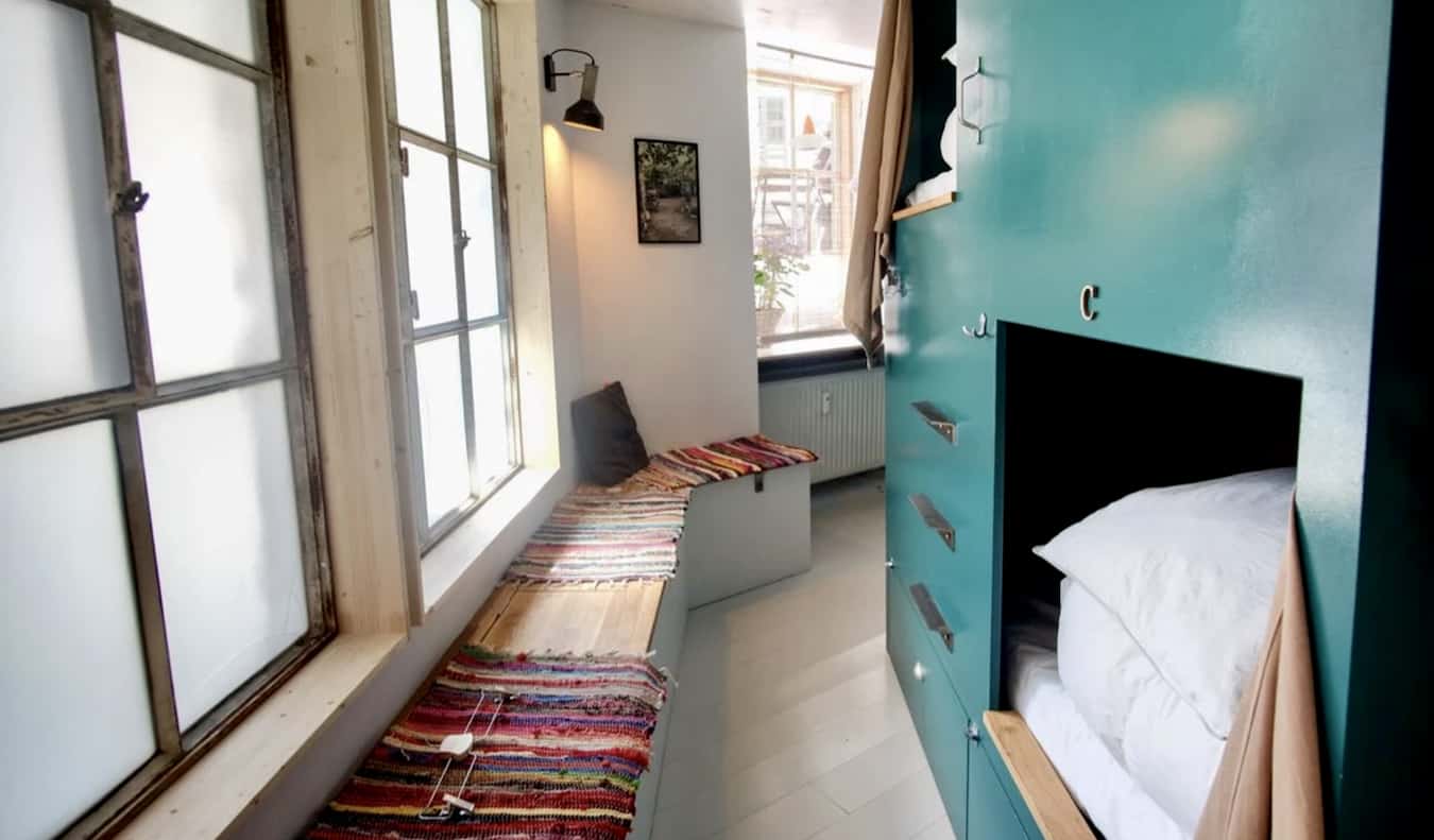 Custom wooden bunk beds in a dorm room at Woodah hostel in Copenhagen, Denmark