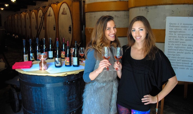 Solo female travelers dressed nicely at a winery abroad