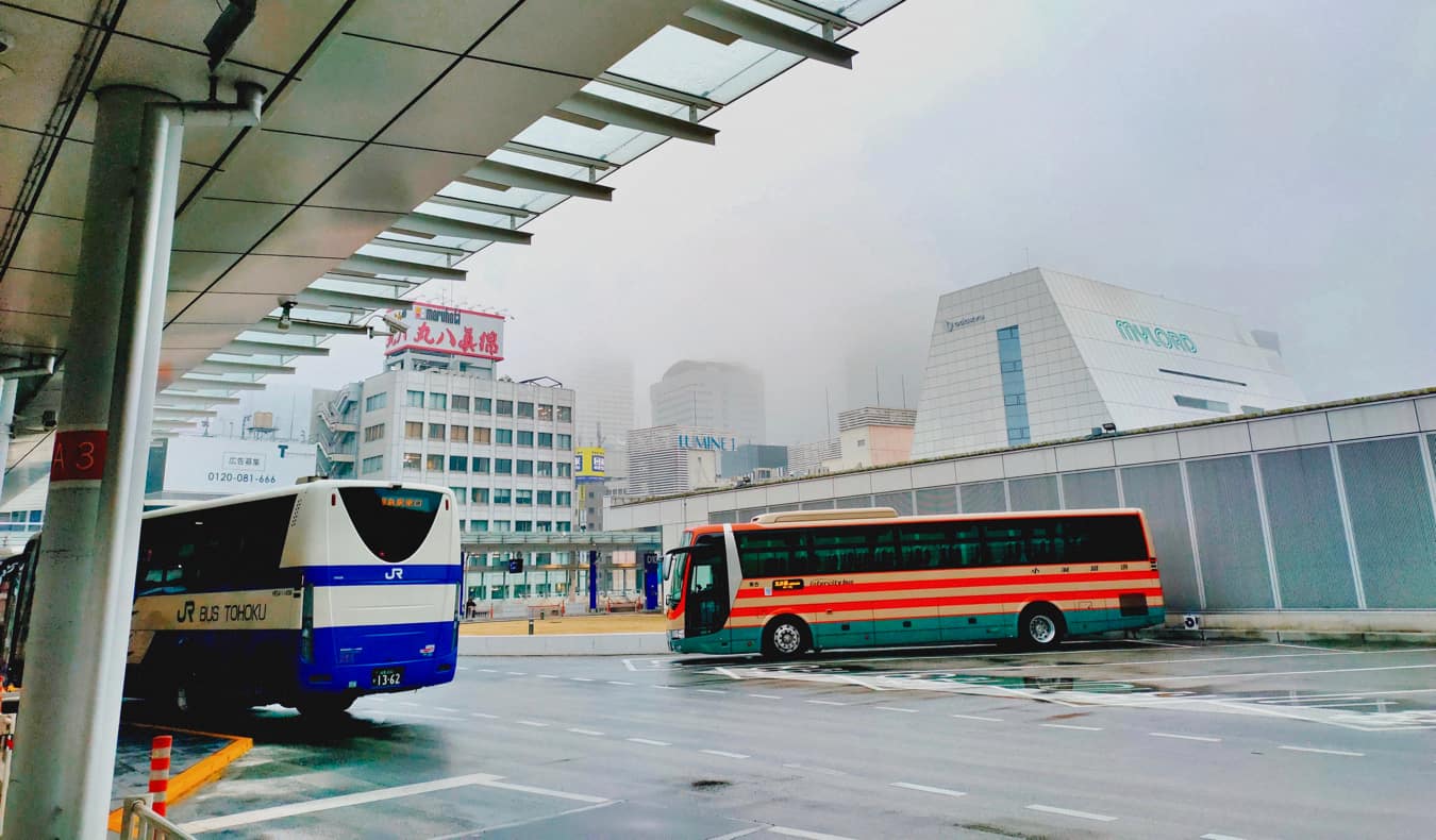 A coach bus in a parking lot in Japan