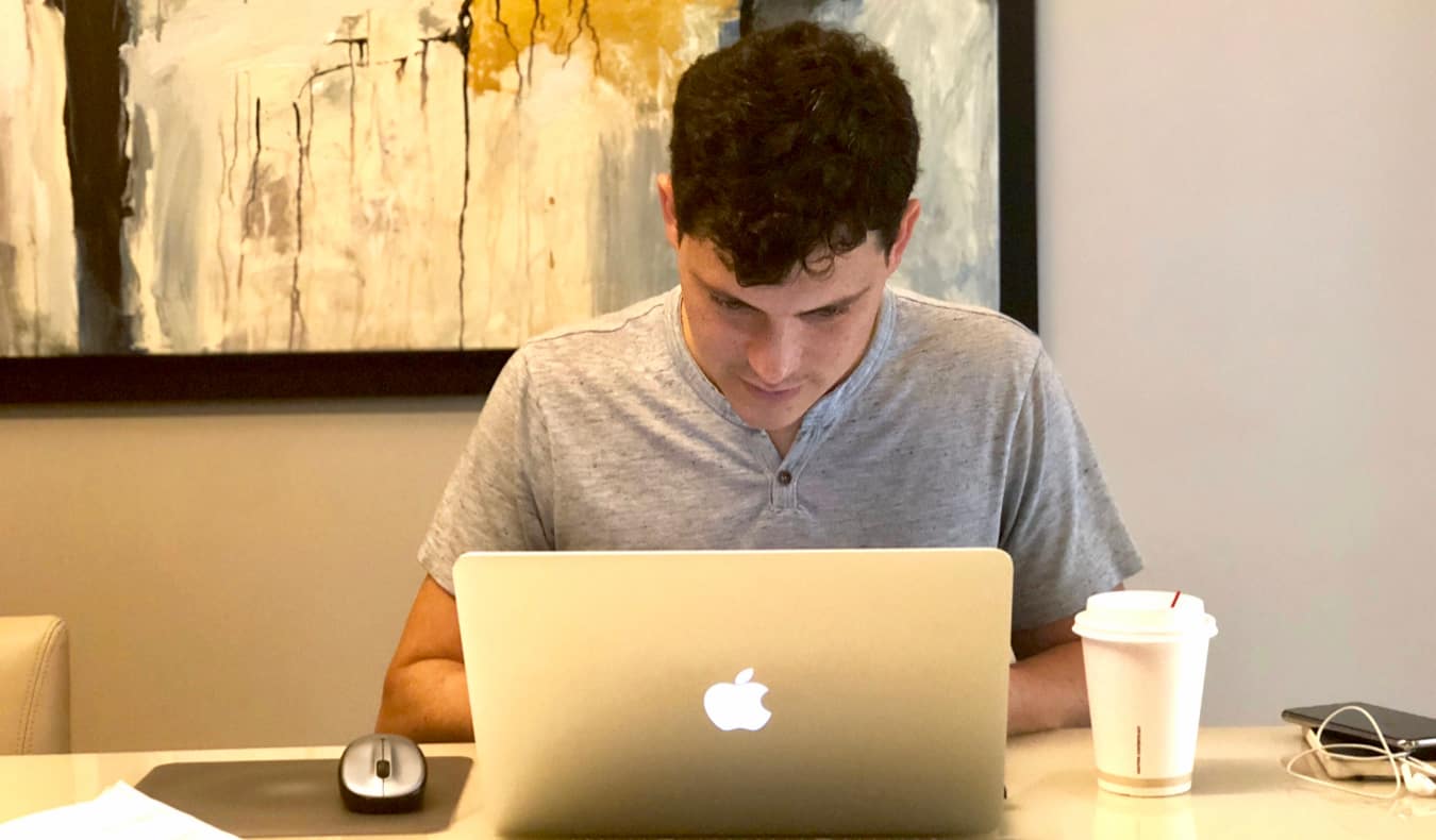 Nomadic Matt working at a laptop as a digital nomad