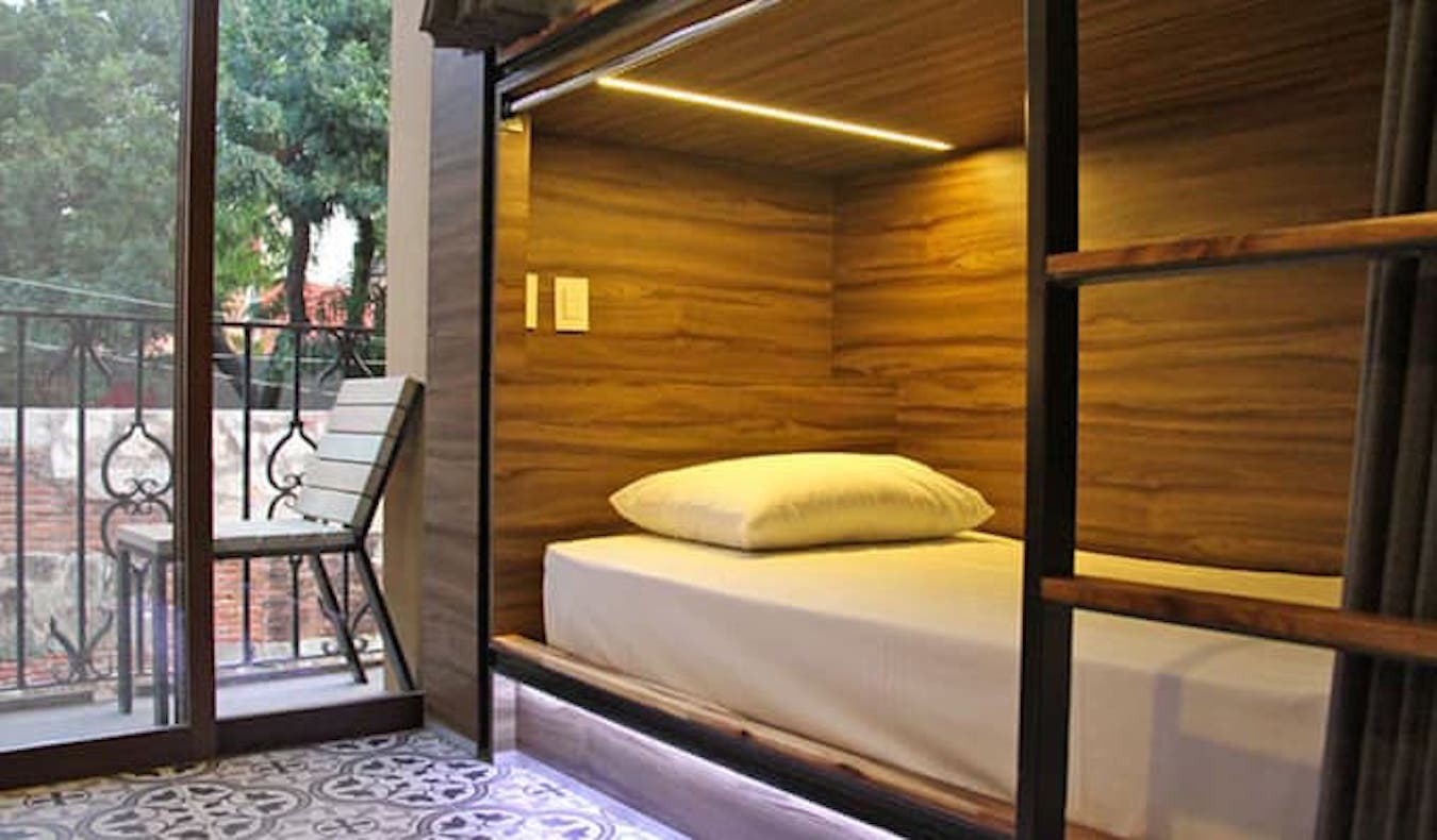 A deluxe dorm bed in the Casa Angel hostel in Oaxaca, Mexico