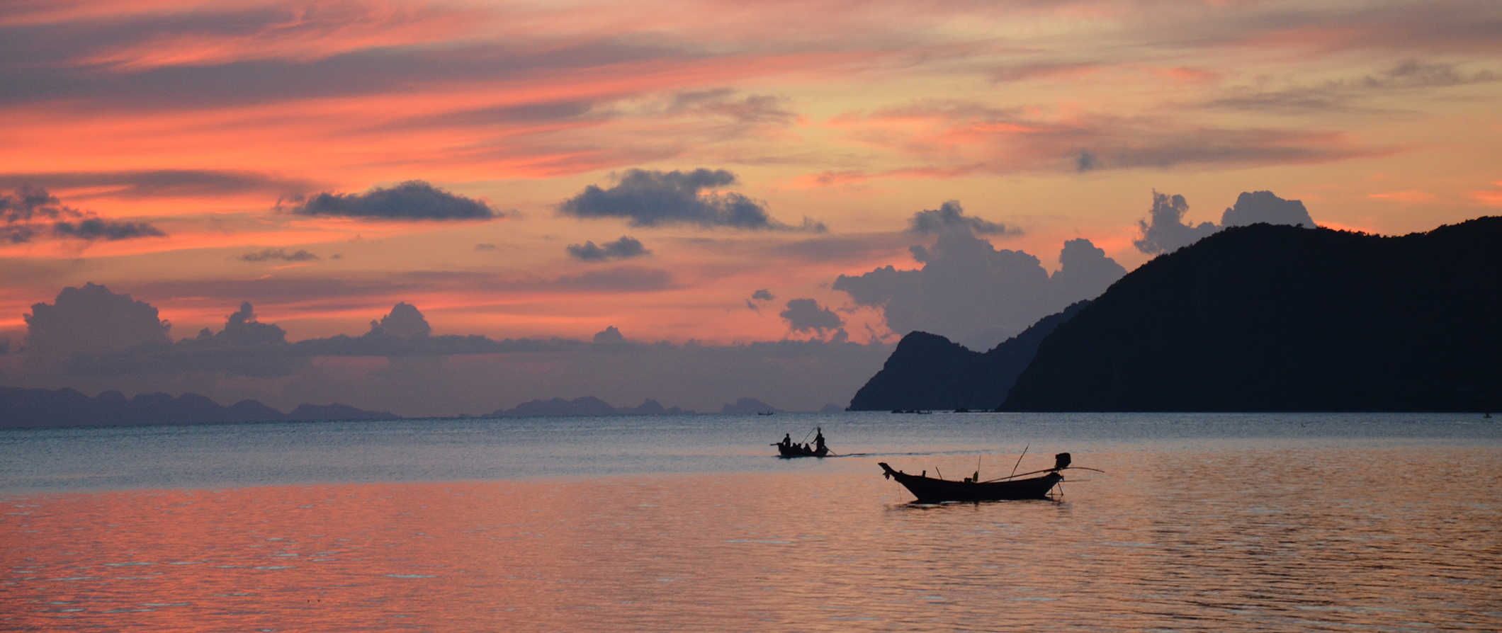 The stunning island of Ko Pha Ngan, Thailand at sunset over the ocean