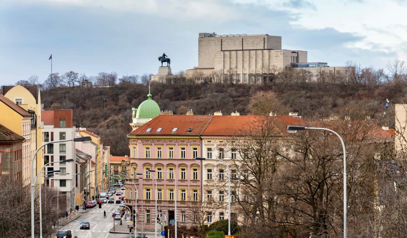 A statue in the distance looking out over the Karlin neighborhood in Prague, Czechia