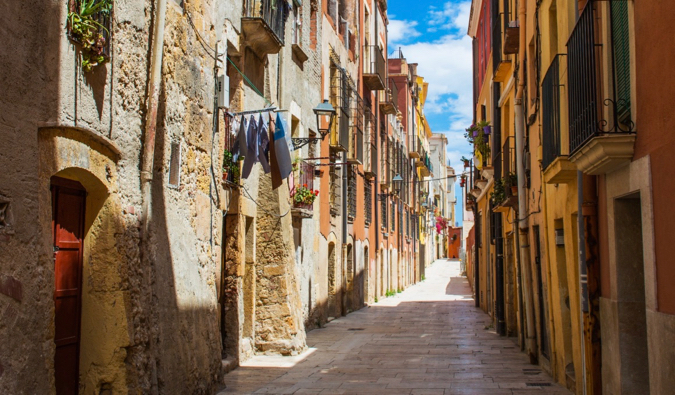 A narrow and winding alley in a traditional area of Catalonia, Spain