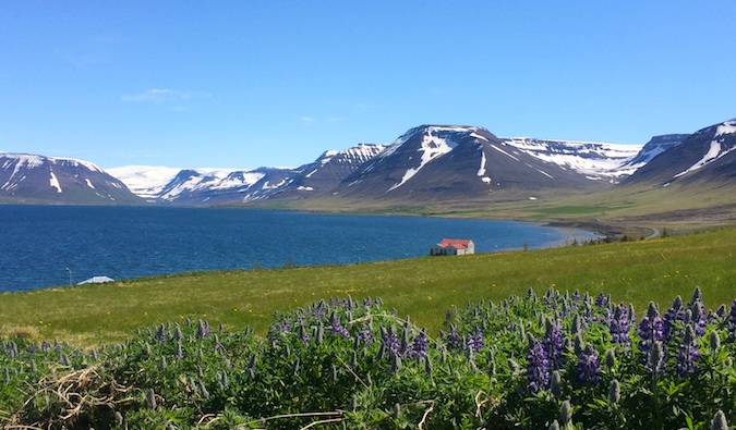 A small house in the distance in the Westfjords in Iceland