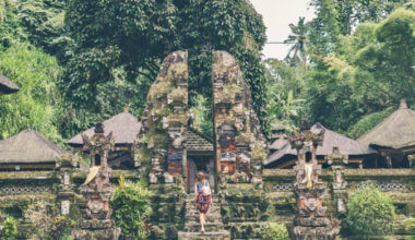 a solo female traveler visiting a temple in Southeast Asia